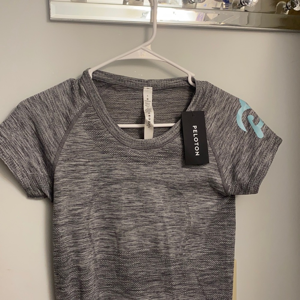 Brand new peloton brand active wear shirt with tags size 6 lululemon material